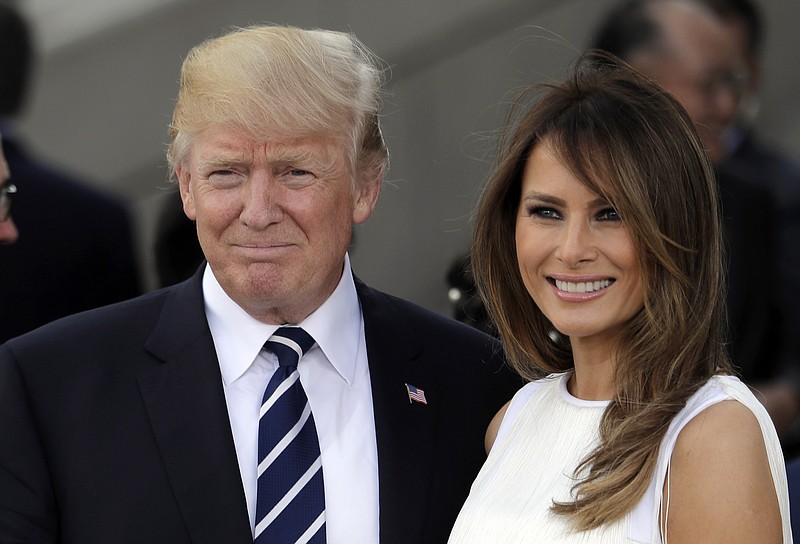 In this July 7, 2017 photo, President Donald Trump, left, and first lady Melania Trump smile prior to a concert on the first day of the G-20 summit in Hamburg, northern Germany. The White House has announced that President Trump and the first lady have decided not to participate in events honoring recipients of this year's Kennedy Center arts awards. (AP Photo/Markus Schreiber)