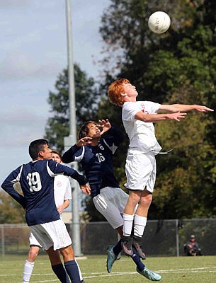 Tucker Jett of the Jays goes up for the ball during action against Marquette last season at Eddie Horn Field.