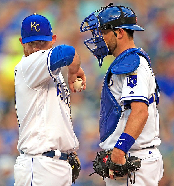 Royals starting pitcher Ian Kennedy and catcher Drew Butera talk after Kennedy gave up a home run during the first inning of Friday night's game against the Indians at Kauffman Stadium.