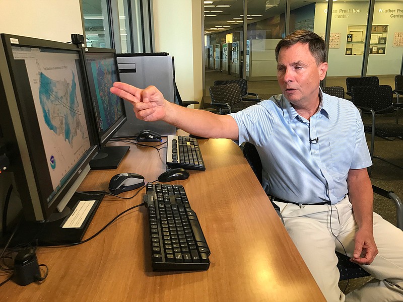 Bruce Sullivan, a forecaster at NOAA's National Weather Service Prediction Center explains that viewing conditions in the zone of totality for the upcoming eclipse, Friday, Aug. 18, 2017, at NOAA in College Park, Md. The early eclipse weather forecast looks best in the West and least in the East with patchy clouds muddling up the picture in between. The forecast as of Friday shows Oregon and Idaho as most promising to have clear sky views, while South Carolina is the most likely to find the sun and moon blocked by clouds. 