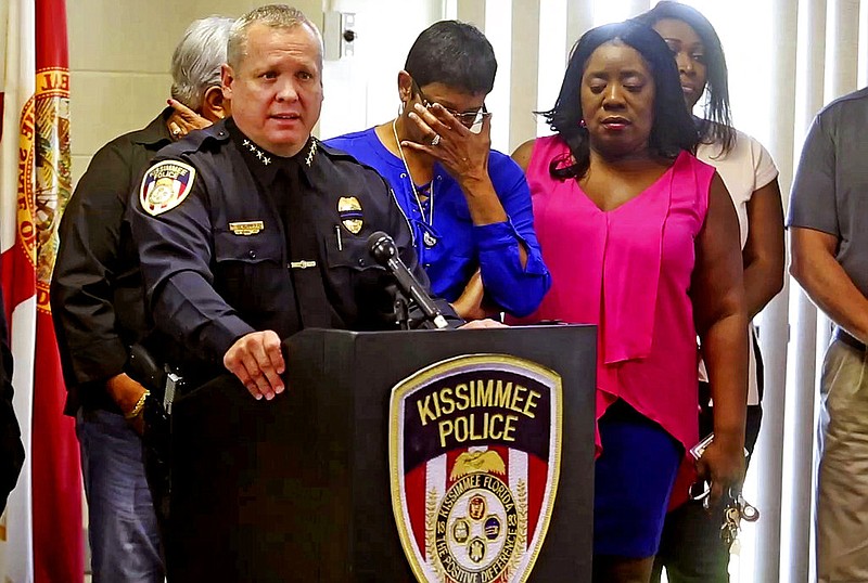 Kissimmee Police Chief Jeff O'Dell, left, holds a news conference Saturday, Aug. 19, 2017 in Kissimmee, Fla. The Kissimmee Police Department says Sgt. Sam Howard died Saturday from his injuries. His colleague, Officer Matthew Baxter, died Friday night after the attack in a neighborhood of Kissimmee, located south of the theme park hub of Orlando. (Red Huber/Orlando Sentinel via AP)