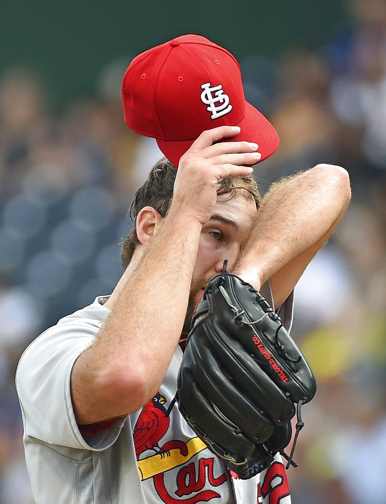 St. Louis Cardinals' Michael Wacha (52) wipes his face in the second inning of a baseball game against the Pittsburgh Pirates in Pittsburgh, Saturday, Aug. 19, 2017.
