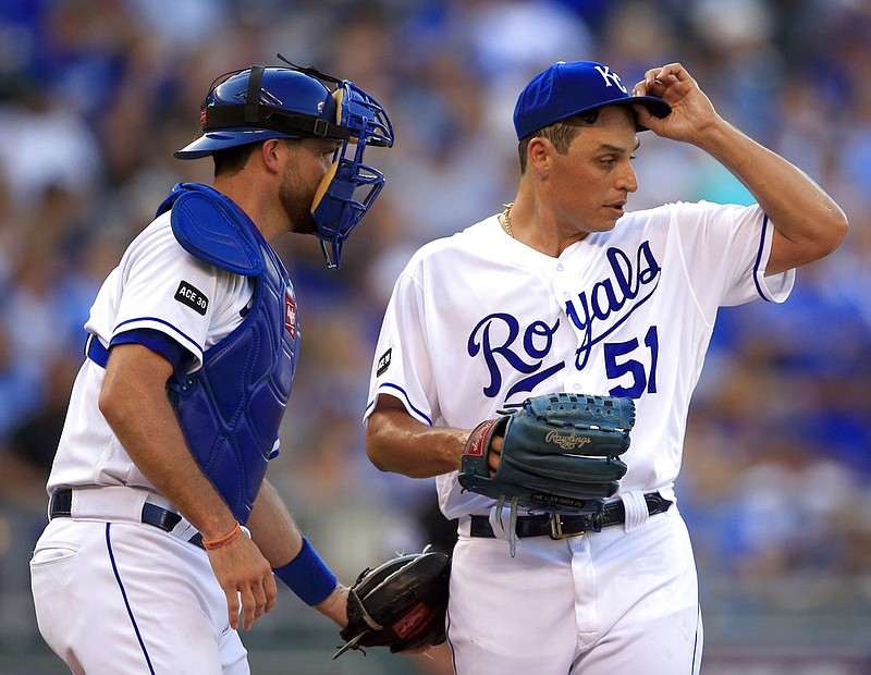 Kansas City Royals starting pitcher Jason Vargas (51) and catcher Drew Butera, left, talk after giving up a run during the first inning of a baseball game against the Cleveland Indians at Kauffman Stadium in Kansas City, Mo., Saturday, Aug. 19, 2017. 