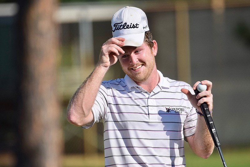 Myles Lewis smiles during the Texarkana Children Charities Open at the Texarkana Country Club.