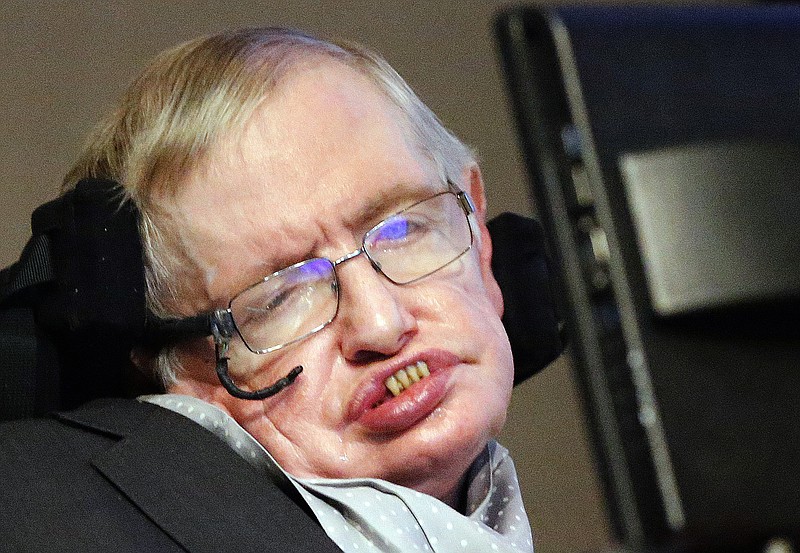 In this Dec. 16, 2015 file photo, professor Stephen Hawking listens to a news conference in London. Noted physicist Hawking has criticized Britain's health secretary for what he described as the selective use of scientific studies to support changes in the National Health Service. The world-renowned scientist has accused Conservative minister Jeremy Hunt of "cherry picking'' evidence to support the changes and says the service is at risk.