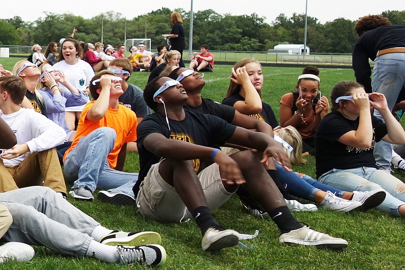 Helen Wilbers/FULTON SUN
Students at Fulton High School look to the skies on Monday, a few minutes before totality. The school distributed eclipse glasses to all students and visitors from Arkansas State University brought telescopes.                                 