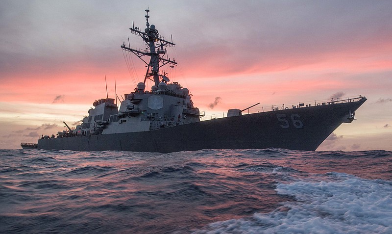 In this Jan. 22, 2017, photo provided by U.S. Navy, the USS John S. McCain conducts a patrol in the South China Sea while supporting security efforts in the region. The guided-missile destroyer collided with a merchant ship on Monday, Aug. 21, in waters east of Singapore and the Straits of Malacca. 