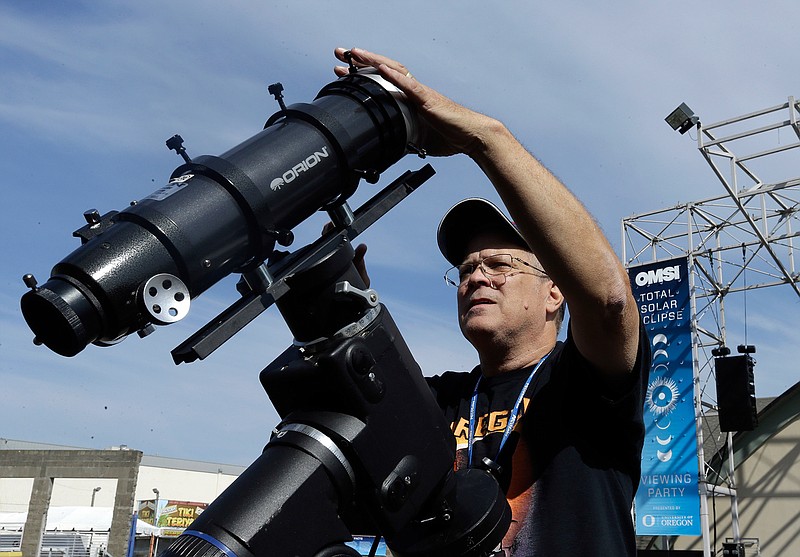 Ray Cooper, volunteer for the Oregon Museum of Science and Industry, preps his equipment to provide live video of the Aug. 21, 2017, solar eclipse at the state fairgrounds in Salem, Ore., Sunday, Aug. 20, 2017.