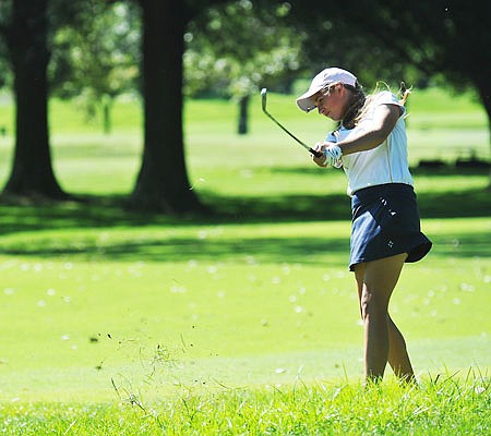 Helias senior Alex Nelson hits a shot during the Capital City Tournament last season at Meadow Lake Acres Country Club.