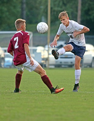 Logan Brauner of Helias kicks the ball away from a Rolla player during a game last season at the 179 Soccer Park. Brauner is one of 13 seniors on the roster for the Crusaders, who open the 2017 season tonight at home against Camdenton.