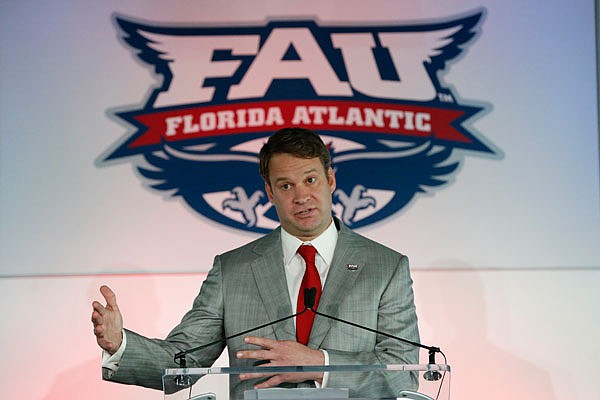 In this Dec. 13, 2016, file photo, Lane Kiffin gestures as he speaks after being introduced as the new Florida Atlantic head football coach in Boca Raton, Fla.