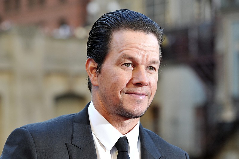 FILE - In this Tuesday, June 20, 2017 file photo,Mark Wahlberg attends the U.S. premiere of "Transformers: The Last Knight" at the Civic Opera House on in Chicago. Wahlberg outmuscled Dwayne Johnson to become Hollywood’s highest-paid actor in the past year with a transforming income of $68 million, according to Forbes magazine. The former rapper and underwear model known as Marky Mark beat out “Baywatch” star Johnson with $65 million and The Rock’s “The Fate of the Furious” co-star Vin Diesel worth $54.5 million(Photo by Rob Grabowski/Invision/AP)