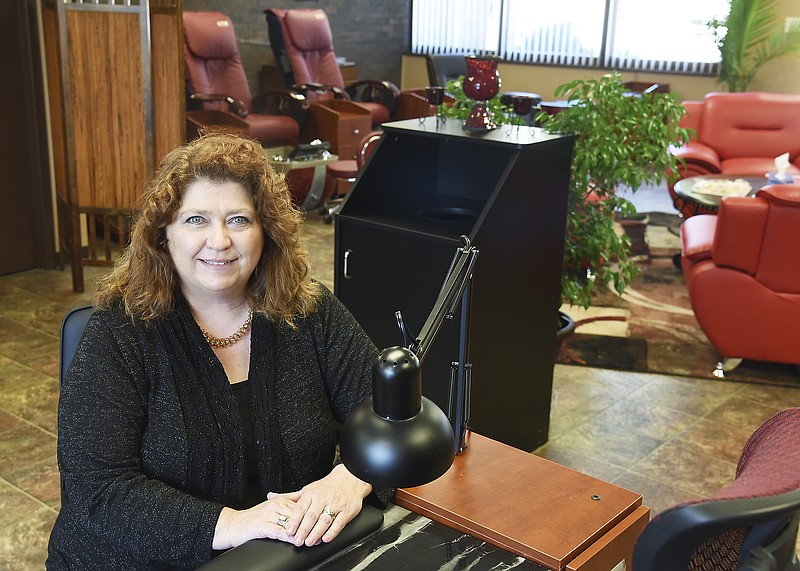 Julie Smith/News Tribune
Cindy Andrews poses in her newly-opened nail salon, Creative Nails, at 2121 Missouri Blvd. 