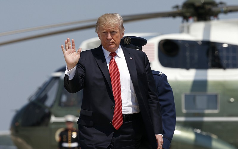 President Donald Trump waves as he walks from Marine One to Air Force One at Andrews Air Force Base, Md., Tuesday, Aug. 22, 2017, before his departure to Arizona and Nevada. (AP Photo/Alex Brandon)