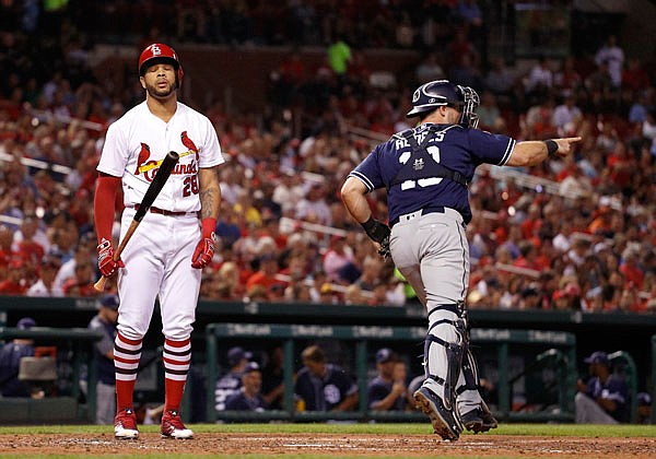Padres catcher Austin Hedges celebrates after Cardinals outfielder Tommy Pham struck out swinging to end the third inning of Tuesday night's game at Busch Stadium in St. Louis.