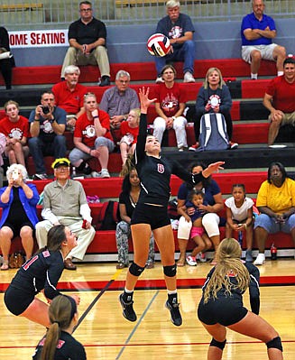 Lady Jays hitter Annabelle Maassen goes up to spike the ball during Tuesday night's match against Rock Bridge at Fleming Fieldhouse.