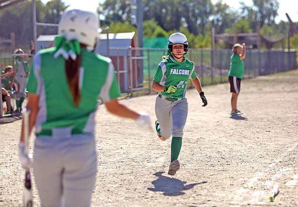 Blair Oaks senior Sydney Wilde heads to home plate for a run against Fox last season during the Capital City Invitational at 63 Diamonds. Wilde is a returning all-state player this fall for the Lady Falcons.