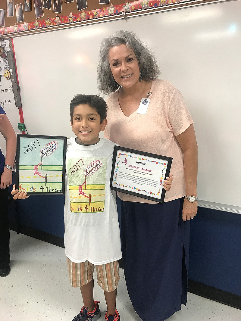 Diego Bustamante, a sixth-grader at Red Lick Middle School, is the winner of the Kids for the Cure T-shirt design contest. He modeled the design with Julie Middlebrooks, his fifth-grade art teacher, on Thursday. Diego completed the design in Middlebrooks' classroom last spring.
