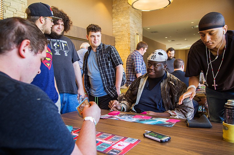 James Eggleston plays a card as Oscar Rivers draws a card from his deck in the first round of a Yu-Gi-Oh! card game tournament on Sept. 4, 2016, at the Ark-La-Tex Comic Con. This year's Comic Con will be held Sept. 2 and 3 at the Texarkana Convention Center. 