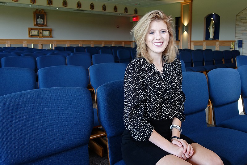 Phillip Sitter/News Tribune 
Helias High School senior Riley Wibberg poses in the school's chapel. Wibberg leaves Monday to spend her final school year in France as a Rotary exchange student. 