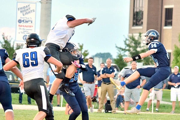 South Callaway's special teams attempt to block a punt by Father Tolton during the Bulldogs' 25-19 win in two overtimes last Friday in Columbia.