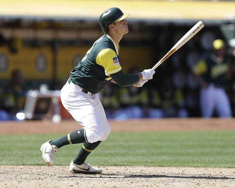 Oakland Athletics' Chad Pinder runs out a pop fly out in the sixth inning of a baseball game against the Texas Rangers Saturday, Aug. 26, 2017, in Oakland, Calif. 