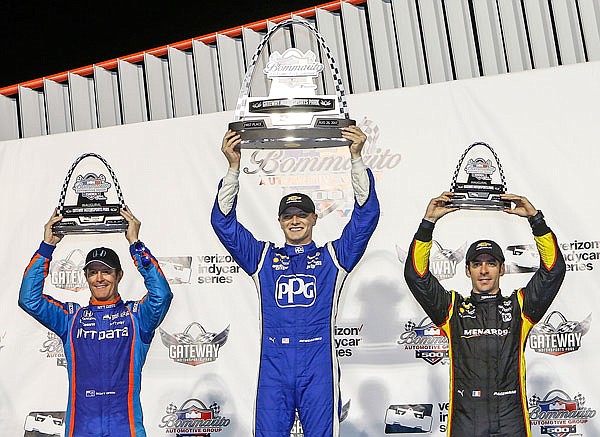 Josef Newgarden (center) celebrates his win while standing next to second-place Scott Dixon (left) and third-place Simon Pagenaud (right) after Saturday's IndyCar race at Gateway Motorsports Park in Madison, Ill.