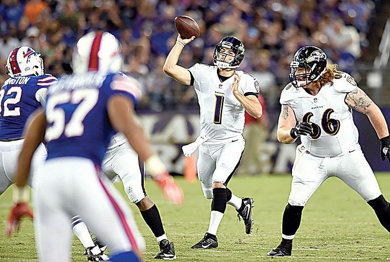 Baltimore Ravens quarterback Josh Woodrum (1) throws to a receiver Saturday in the first half of a preseason game against the Buffalo Bills in Baltimore.
