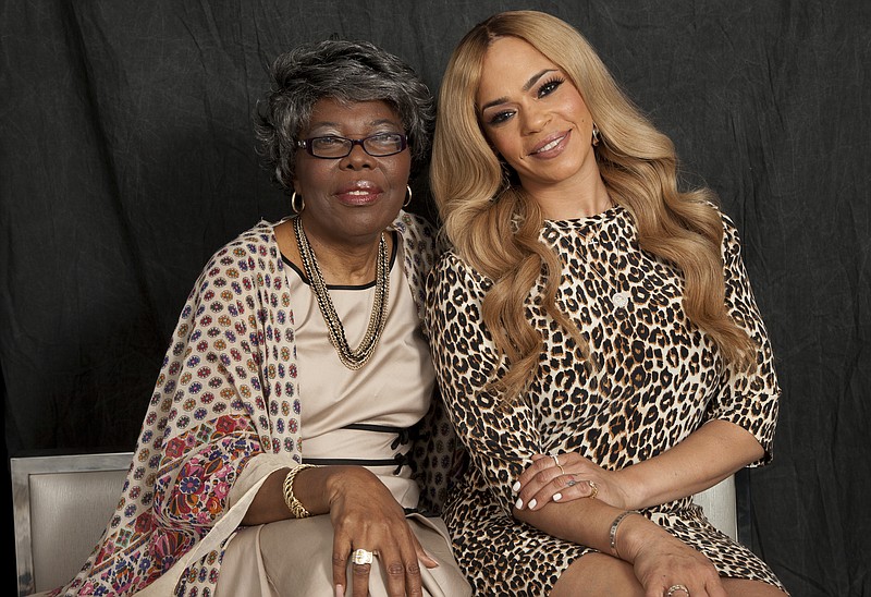 In this Thursday, Aug. 17, 2017, photo, Voletta Wallace, left, and Faith Evans, right, pose for a portrait in New York. Wallace details the love for the Notorious B.I.G. as both his mother and No. 1 fan in the new, three-hour documentary, “Biggie: The Life of Notorious B.I.G.” It debuts Monday, Sept. 4 at 8 p.m. EST on A&E. (Photo by Andy Kropa/Invision/AP)