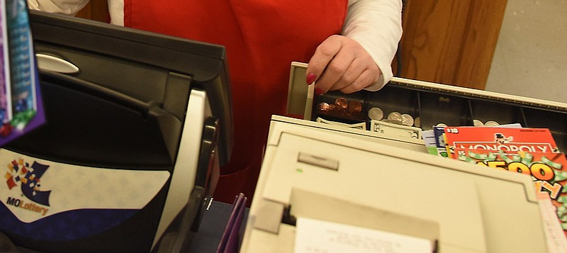 A Missouri Lottery retail computer is shown next to a cash register drawer at a Mid-Missouri business in this Jan. 13, 2016 file photo.