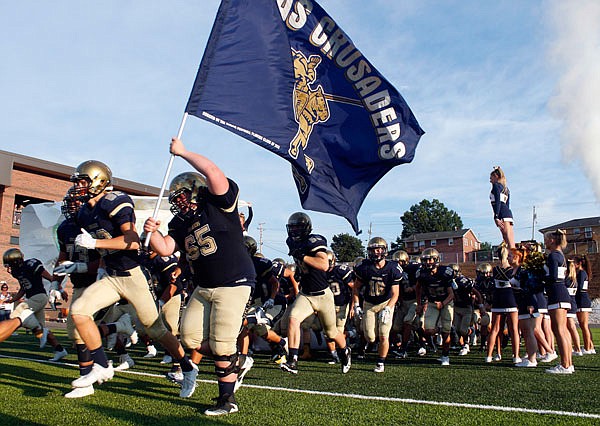 The Helias Crusaders take the field before their season opener against the Hannibal Pirates at Ray Hentges Stadium. Helias returns home tonight to host Bishop Althoff in a battle of Crusaders.
