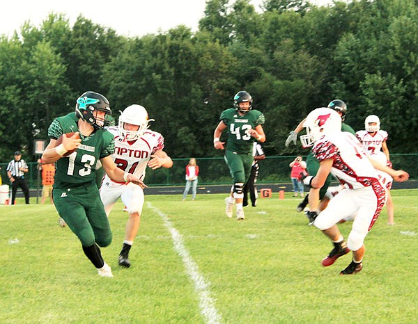 North Callaway running back Jordan Delashmutt tries to elude a Tipton defender during the Thunderbirds' 47-0 win against the Cardinals last week in Kingdom City.