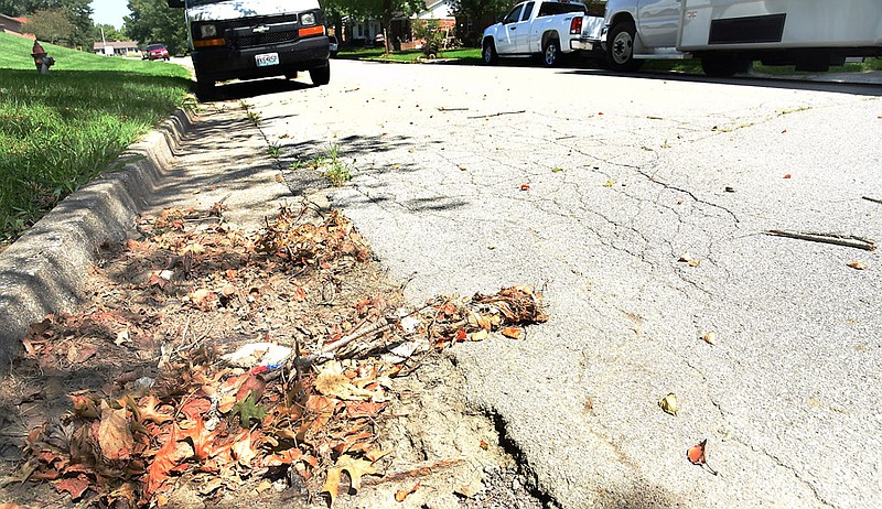 Clogged storm drains, like the one shown here, can cause rain water to back up and flood Jefferson City streets in low-lying areas.