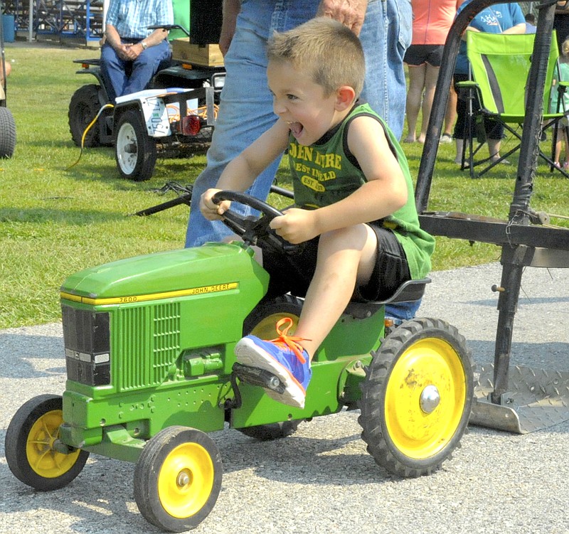 John Deere enthusiast Corbin Schaffner earned a full pull on his first ride at the Jamestown Lions Club Fair and came in second overall.