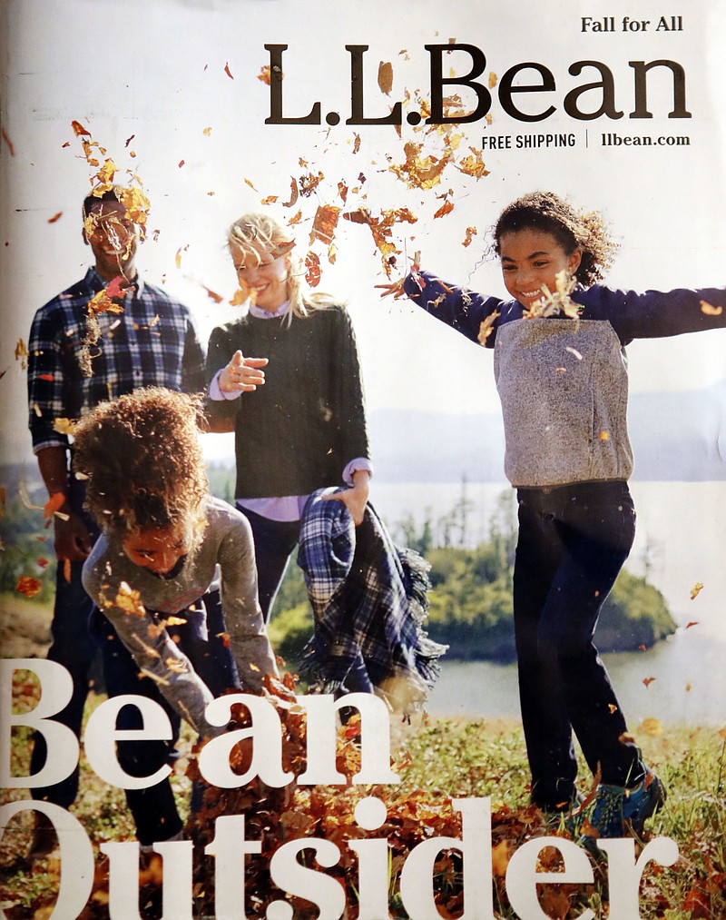 This catalog cover provided by L.L. Bean shows their new ad campaign "Be an Outsider," that embraces its hunting and fishing traditions but emphasizes the outdoors as an accessible place to enjoy with friends and family. (Cathrine Wressel/L.L. Bean via AP)
