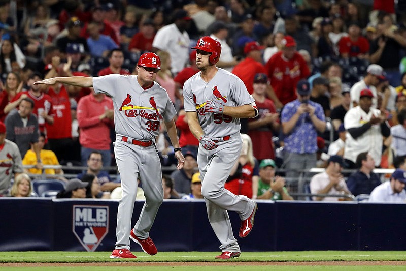 St. Louis Cardinals' Stephen Piscotty, right, is greeted by St. Louis Cardinals third base coach Mike Shildt after hitting a two-run home run during the seventh inning of a baseball game against the San Diego Padres on Wednesday, Sept. 6, 2017, in San Diego. 