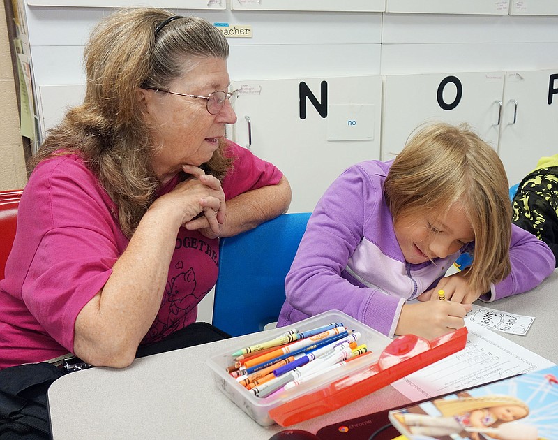 Izabella Bridges makes a bookmark for her great aunt, Maggie Hawkins, during Grandparents Day Friday morning, Sept. 8, 2017 at Bush Elementary.