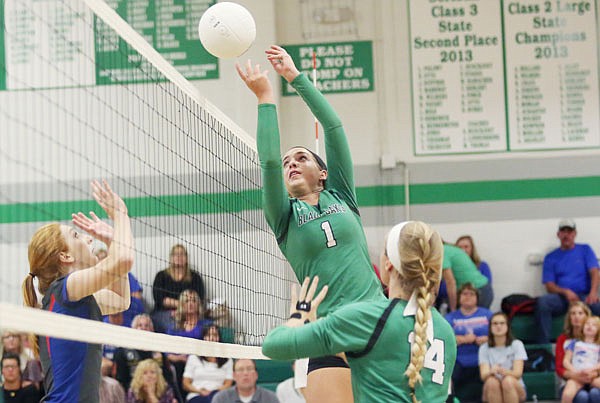 Ali Juergensmeyer of Blair Oaks puts the ball over the net during Thursday night's match against California in Wardsville.