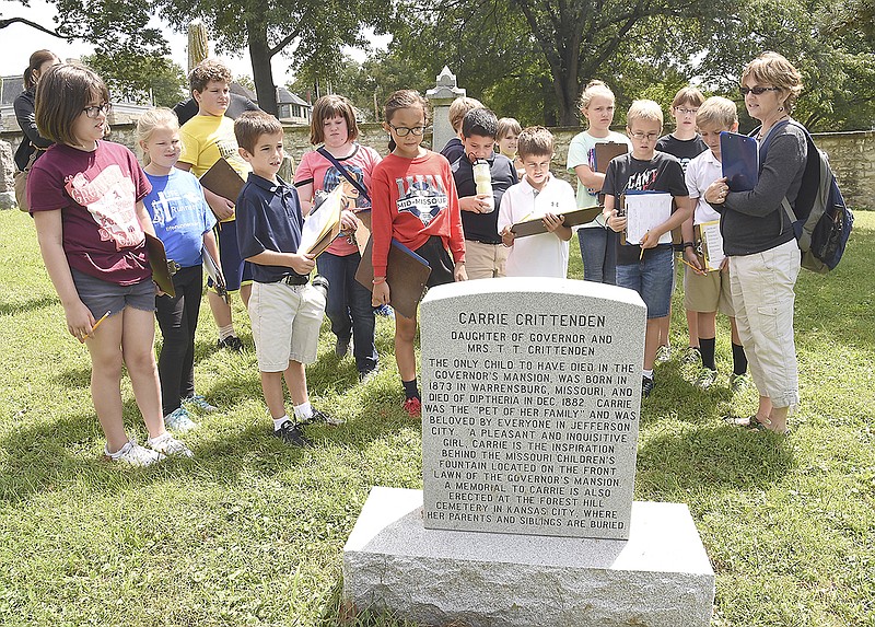 Students in Ruth Caplinger's, at right, Exploration, Enrichment and Research classes have been touring landmarks and historical spots this week and taking notes of interest along the way. Students took tours Wednesday of Woodland-Old City Cemetery, locating grave markers and matching names with landmarks, streets or buildings they visited. 