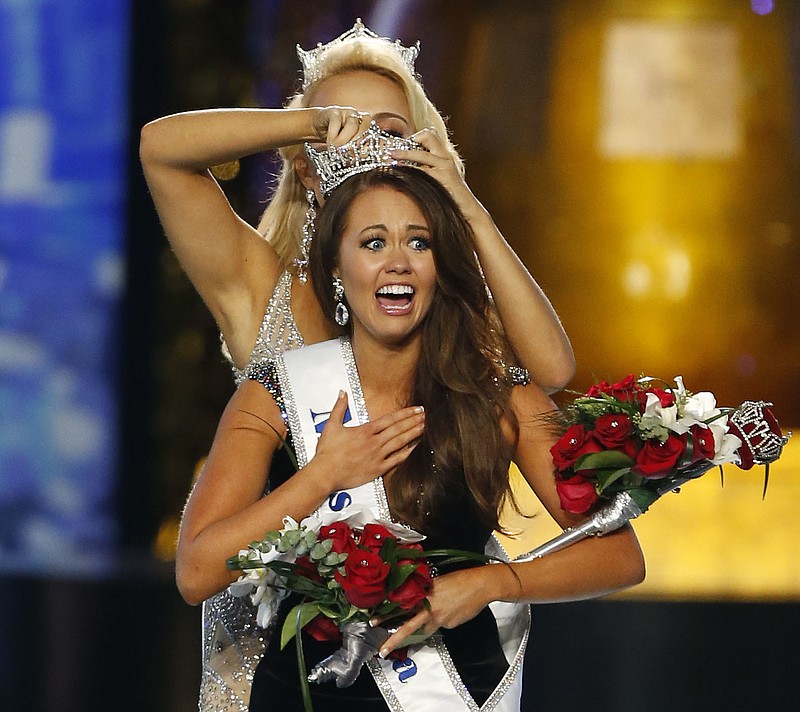 Miss North Dakota Cara Mund reacts after being named Miss America during Miss America 2018 pageant, Sunday, Sept. 10, 2017, in Atlantic City, N.J. (AP Photo/Noah K. Murray)