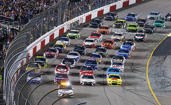 The field does a four-wide warmup loop prior to the start of Saturday's NASCAR Cup Series race at Richmond International Raceway in Richmond, Va.