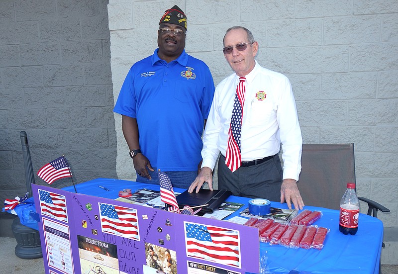 Set up outside Walmart in Fulton, District 9 Commander Charles Williams, left, and chaplain Dave Coleman inform area residents about their membership in VFW Post 2657.