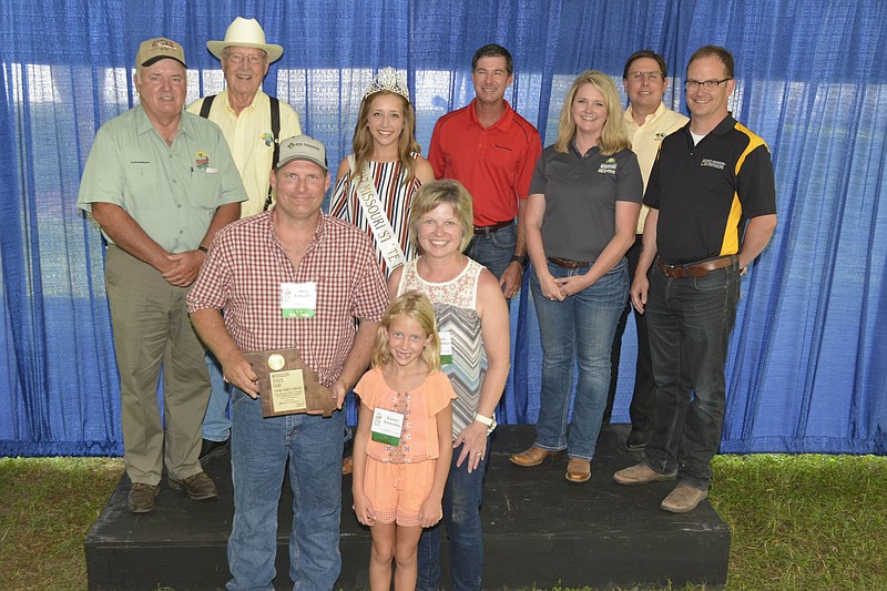 From left are Ted Sheppard and Jack Magruder, both Missouri State Fair commissioners, and Steve Rentschler with his wife Karen and daughter Kinsley. Behind them is Natalie Ayers, 2017 Missour State Fair Queen. Also shown are Todd Hays of the Missouri Farm Bureau, Christine Chinn of the state Department of Agriculture, Rob Kallenbach of University of Misouri and Blake Naughton, MU Extension.