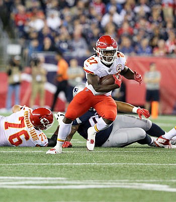 Chiefs running back Kareem Hunt breaks away on a run during last Thursday night's game against the Patriots in Foxborough, Mass.