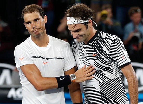 Roger Federer (right) is congratulated by Rafael Nadal after winning their match in the men's singles final at the Australian Open earlier this year in Melbourne, Australia. 