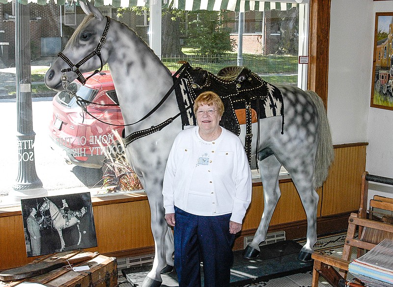 Marilyn Heck-Jensen, descendant of the owners of Heck Saddlery, with the restored Heck Horse on Sept. 6, 2017 during a visit to California. The life-sized display horse is in the museum at the Moniteau County Historical Society.