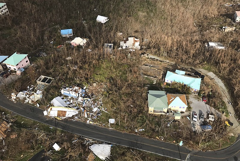 This photo provided by Caribbean Buzz Helicopters on Tuesday, Sept. 12, 2017, shows storm damage in the aftermath of Hurricane Irma in Cruz Bay, St. John, U.S. Virgin Islands. (Caribbean Buzz Helicopters via AP)