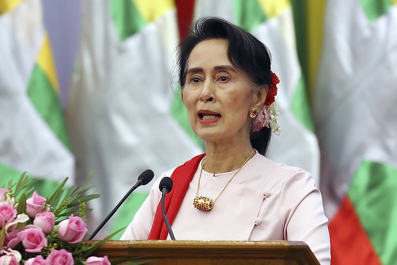 FILE - In this Friday, Aug. 11, 2017, file photo, Myanmar's State Counsellor Aung San Suu Kyi delivers an opening speech during the Forum on Myanmar Democratic Transition in Naypyitaw, Myanmar. Suu Kyi has canceled plans to attend the U.N. General Assembly, with her country drawing international criticism for violence that has driven at least 370,000 ethnic Rohingya Muslims from the country in less than three weeks. (AP Photo/Aung Shine Oo, File)