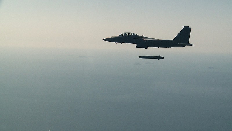 In this photo provided by South Korea Defense Ministry, a South Korean air force F-15K fighter jet releases a Taurus missile during a drill  off the country's western coast, South Korea, Wednesday, Sept. 13, 2017. South Korea says it conducted its first live-fire drill for an advanced air-launched cruise missile it says will strengthen its pre-emptive strike capability against North Korea in the event of crisis. (South Korea Defense Ministry via AP)