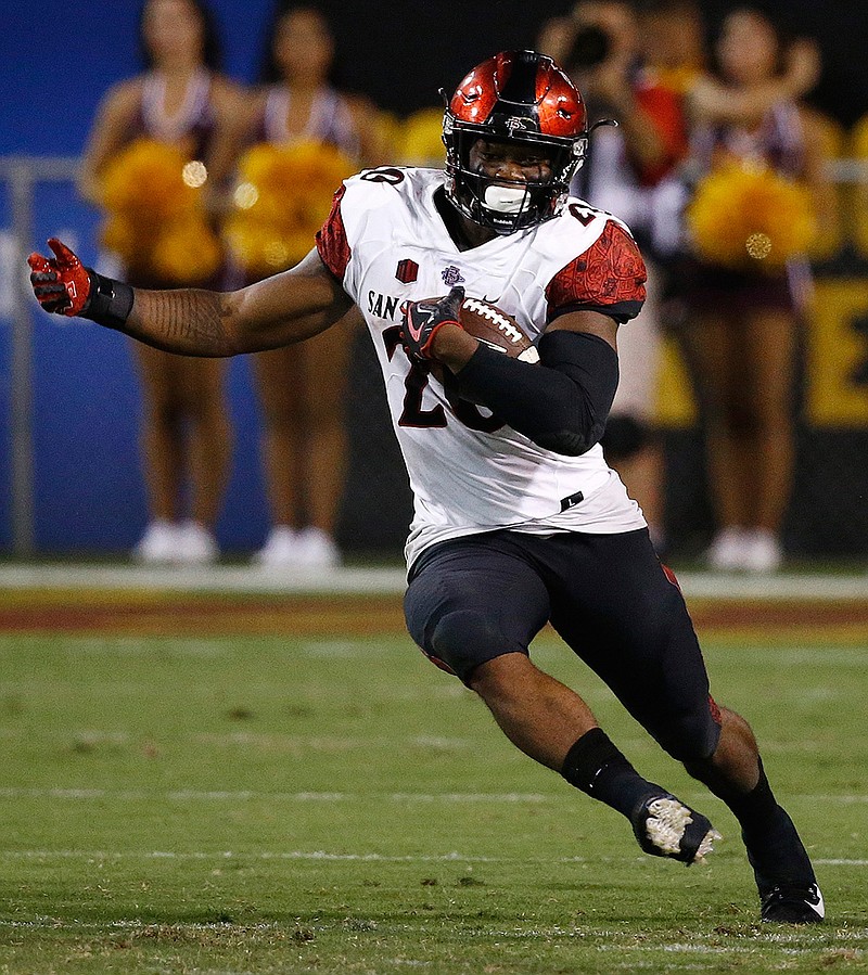 In this Sept. 9, 2017, file photo, San Diego State's Rashaad Penny runs against Arizona State during the second half of an NCAA college football game, in Tempe, Ariz.  Penny leads the nation in all-purpose yards at 284 per game and will get a chance to take down another Pac-12 team on Saturday when No.  19 Stanford comes to San Diego.